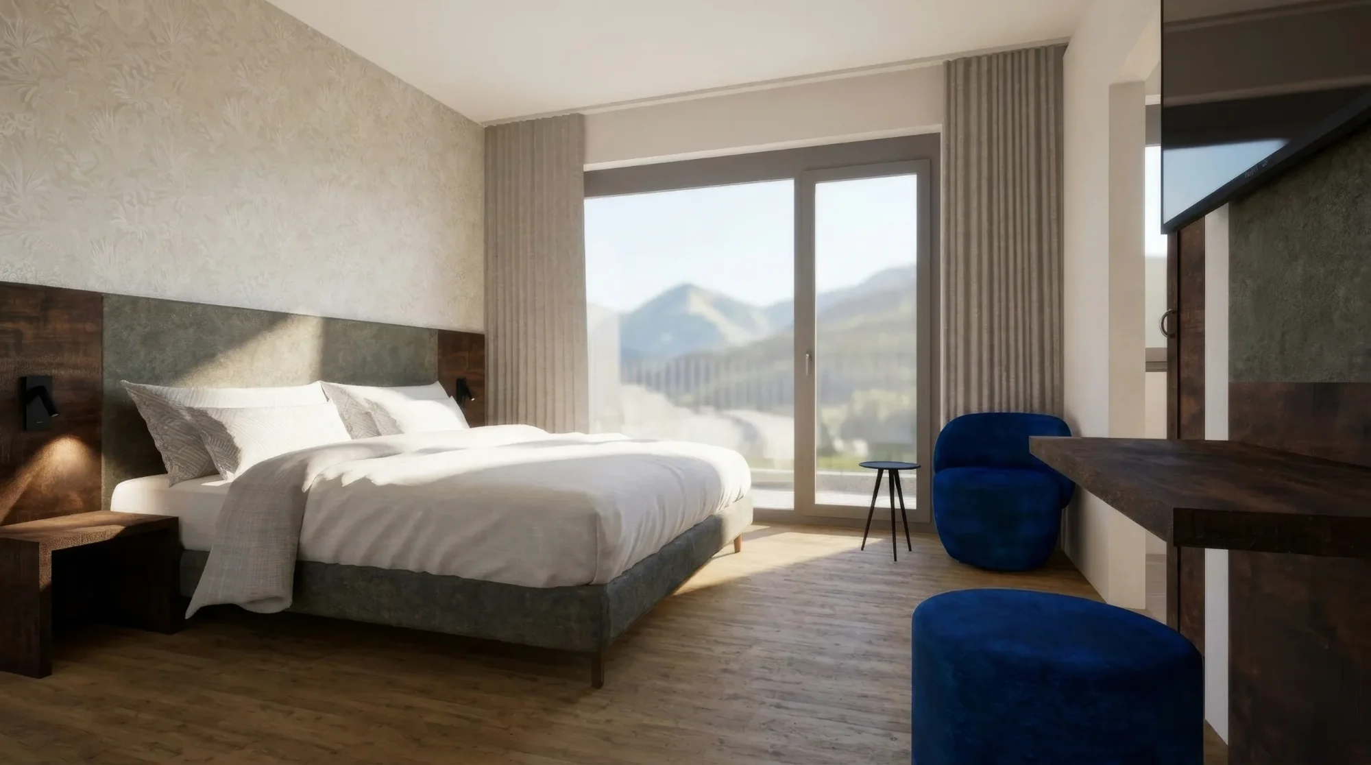 Modernes Schlafzimmer mit Doppelbett, blauem Sessel, Holzboden und großer Fensterfront mit Bergblick.